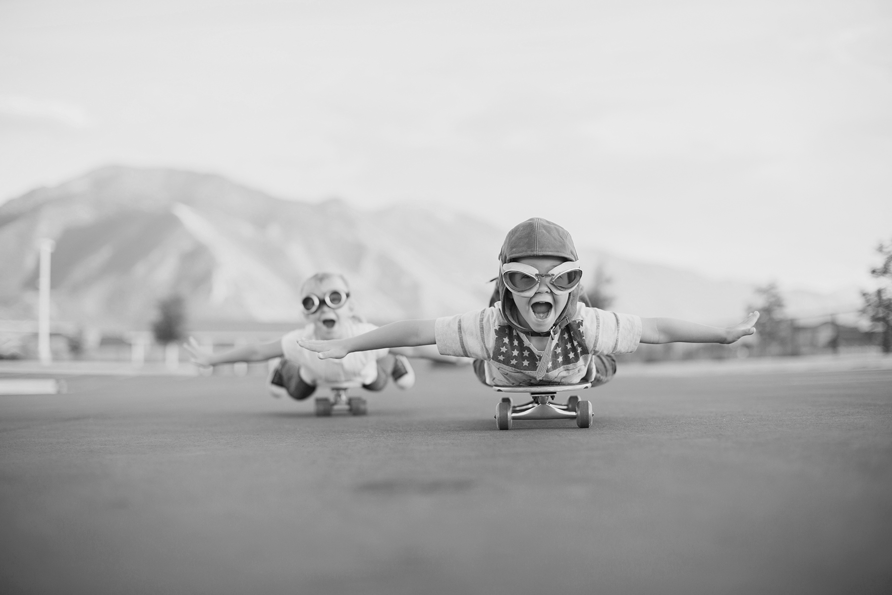 Young Boy and Girl Imagine Flying On Skateboard